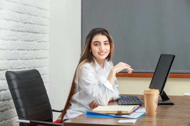 adorable-girl-sitting-office-smiling-high-quality-photo_144627-75140.webp