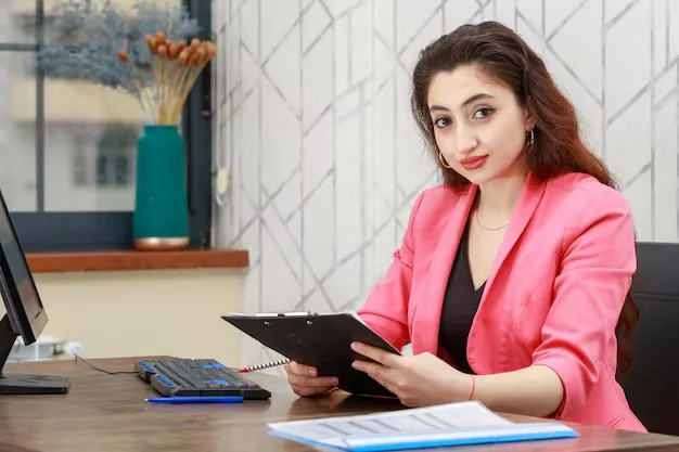beautiful-girl-holding-her-notebook-smiling-camera-high-quality-photo_144627-75837.webp