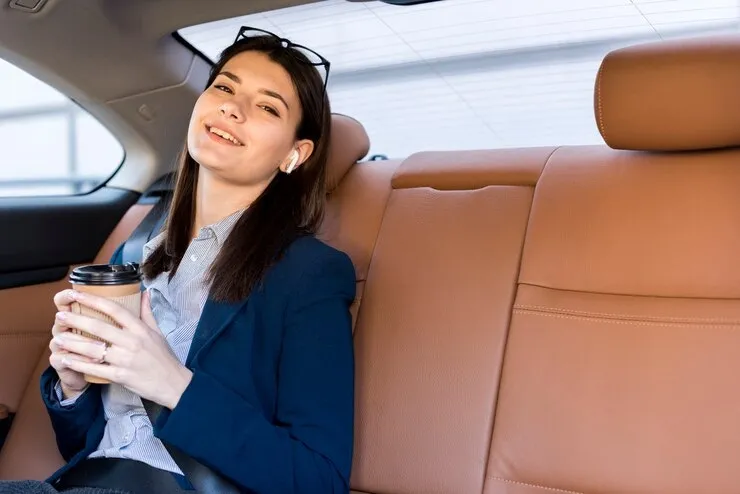 brunette-businesswoman-posing-inside-car_23-2148142620.webp