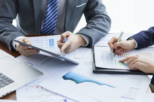 businessmen-elegant-suits-business-meeting-discussing-new-project-office_181624-47022 (1).webp