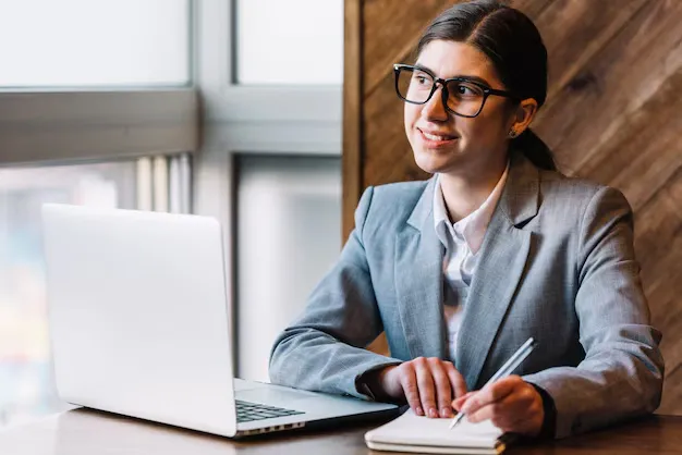 businesswoman-with-laptop-coffee-shop_23-2148002369.webp