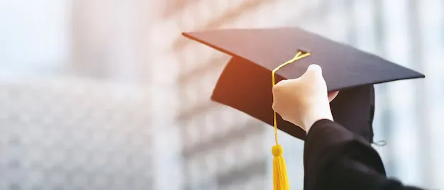 close-up-graduate-hand-hold-show-hat-background-school-building-shot-graduation-cap-commencement-university-degree-education-student-success-learning-concept_109549-73.webp