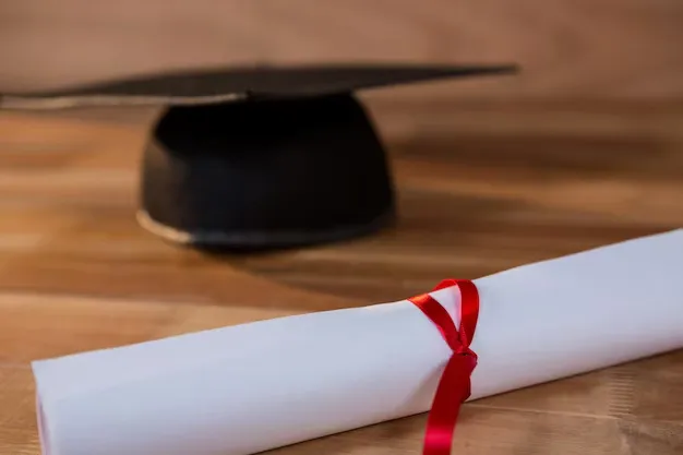 close-up-graduation-certificate-with-mortar-board-table_1252-729.webp