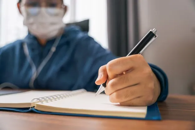 close-up-hand-young-girl-wear-mask-writing-note-book-looking-video-conference-laptop-computer-online-internet-learning-distance-education-home_61243-1222.webp