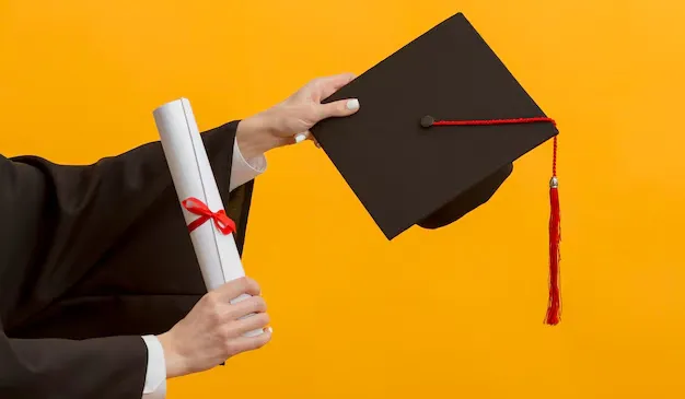 close-up-hands-holding-diploma-cap_23-2148950581 (1) (1).webp