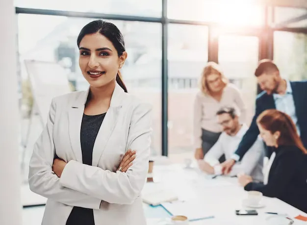 crossed-arms-meeting-portrait-business-woman-office-with-confidence-career-growth-smile-pride-female-finance-banker-with-team-company-investment-with-discussion-boardroom_590464-418027.webp