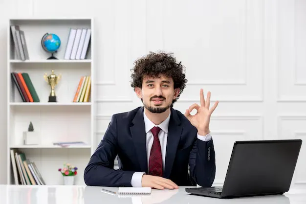 customer-service-curly-brunette-young-man-office-suit-red-tie-with-laptop-confident_140725-162724.webp