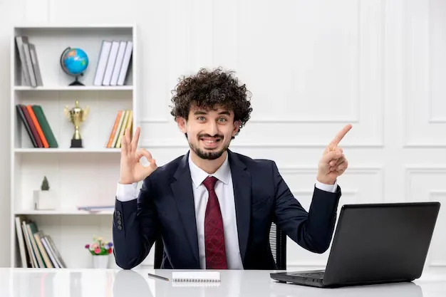 customer-service-curly-brunette-young-man-office-suit-red-tie-with-laptop-happy-smiley_140725-162728.webp