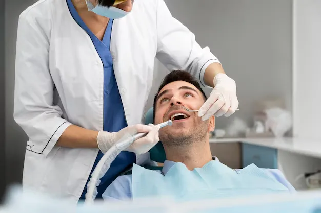 dentist-doing-check-up-patient_23-2149206225.webp