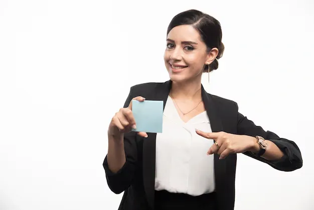 female-employee-pointing-memo-pad-white-background-high-quality-photo_114579-62401.webp