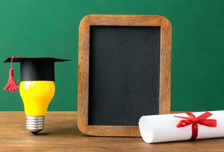 front-view-blackboard-with-lightbulb-academic-cap_23-2148756632.webp