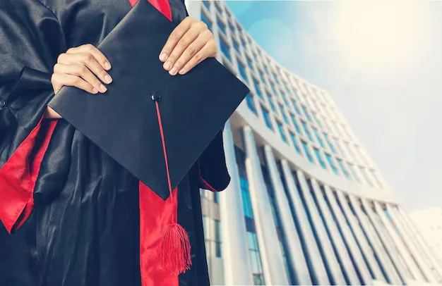 graduating-student-girl-holding-hat_488220-10386.webp