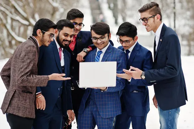 group-six-indian-businessman-suits-posed-outdoor-winter-day-europe-looking-laptop_627829-13345.webp