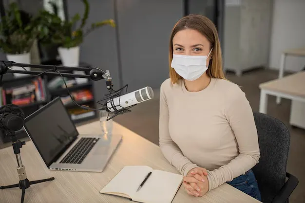 high-angle-woman-with-medical-mask-radio-studio_23-2148808727.webp