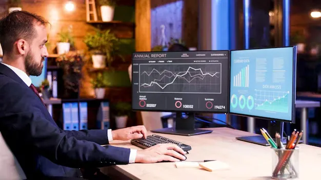 manager-working-program-semester-report-works-two-monitors_482257-32824.webp