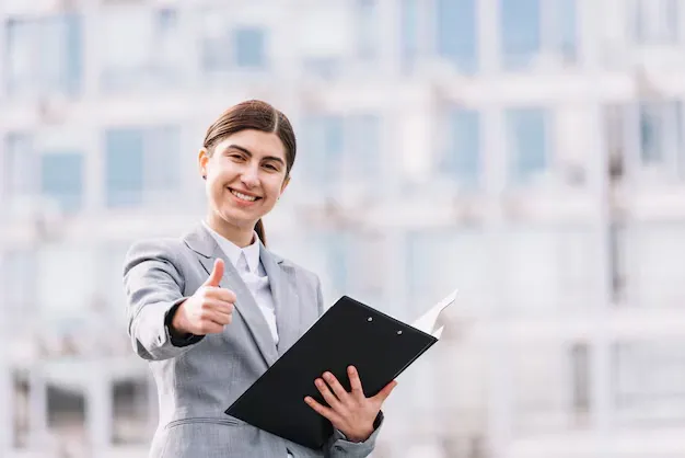 modern-businesswoman-with-clipboard-outdoors_23-2148002240.webp