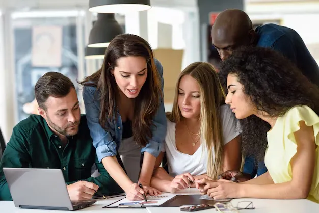 multi-ethnic-group-young-men-women-studying-indoors_1139-989.webp