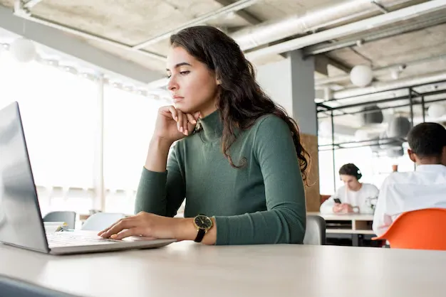 pensive-beautiful-woman-using-laptop_236854-5952 (1).webp