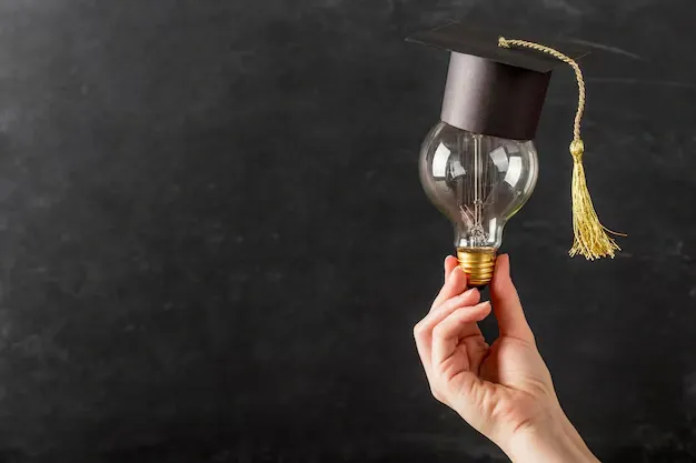 person-holding-light-bulb-with-graduation-cap_23-2148721299 (1).webp