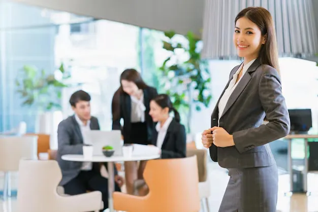 portrait-close-up-smart-attractive-asian-business-female-smile-with-confident-leadership-modern-office-background_609648-1462.webp