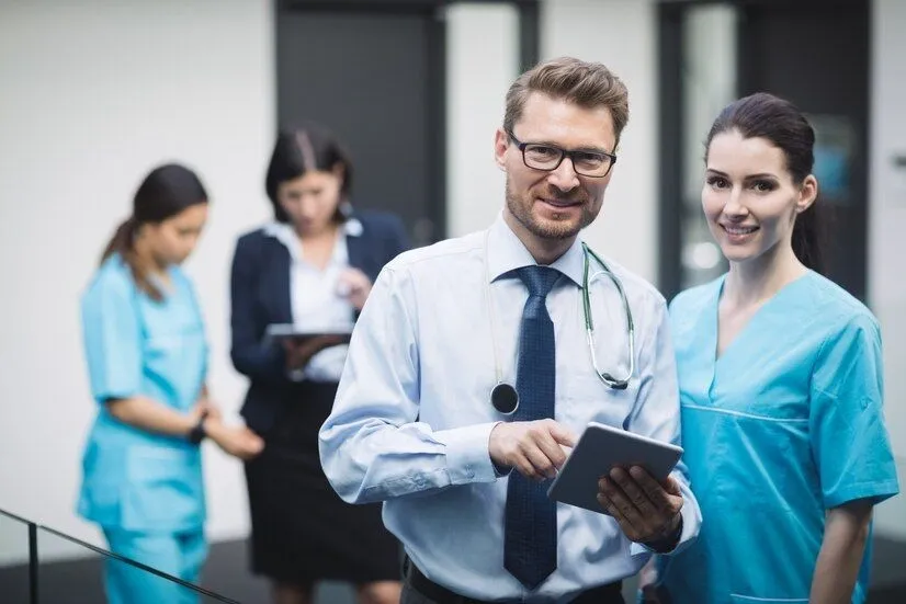 smiling_doctor_nurse_with_digital_tablet_107420_84817_1b5ae05ee2.webp