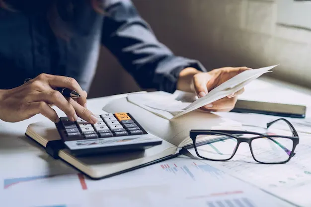 stressed-young-woman-checking-bills-taxes-bank-account-balance-calculating-expenses-living-room-home_44943-1003.webp
