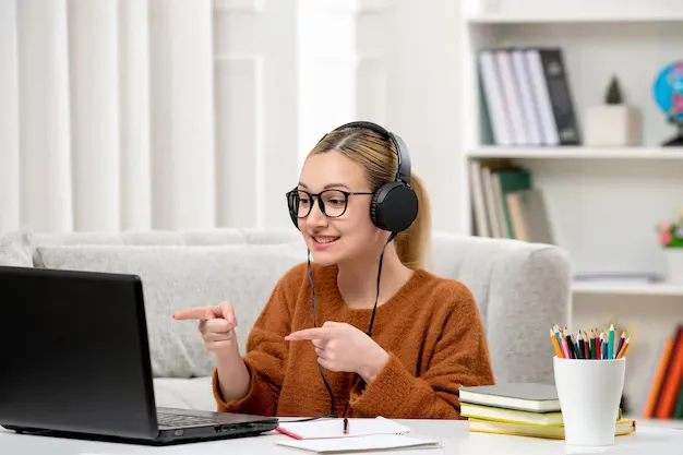 student-online-cute-girl-glasses-sweater-studying-computer-smiling_140725-164128.webp