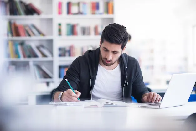 student-preparing-exam-learning-lessons-school-library-making-research-laptop-browse-internet_530697-86223.webp