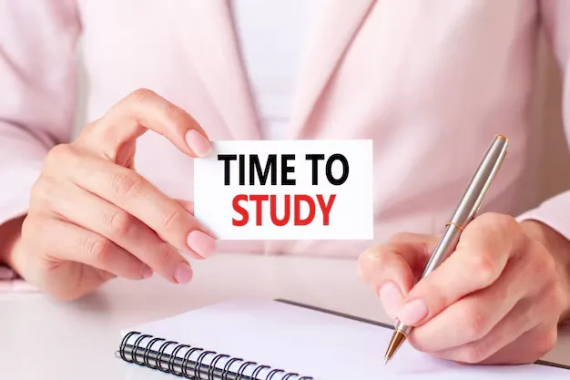 woman-writes-notebook-with-silver-pen-hand-hold-card-with-text-time-study_384017-969.webp