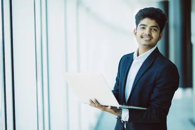 young-businessman-with-laptop-computer-working-office_231208-2579.webp